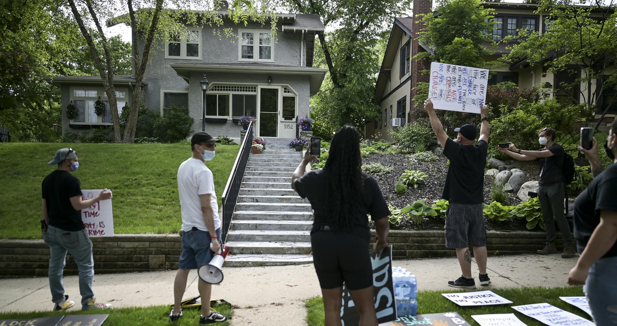 A few dozen protesters demanded justice for George Floyd outside the home of Hennepin County Attorney Mike Freeman Wednesday. ] aaron.lavinsky@startribune.com A protest was held outside the home of Hennepin County Attorney Mike Freeman's home on Wednesday, May 27, 2020 in Minneapolis, Minn. Mayor Jacob Frey on Wednesday called for an arrest and charges against the now-fired Minneapolis police officer Derek Chauvin who knelt on the neck of George Floyd as he pleaded to breathe shortly before his