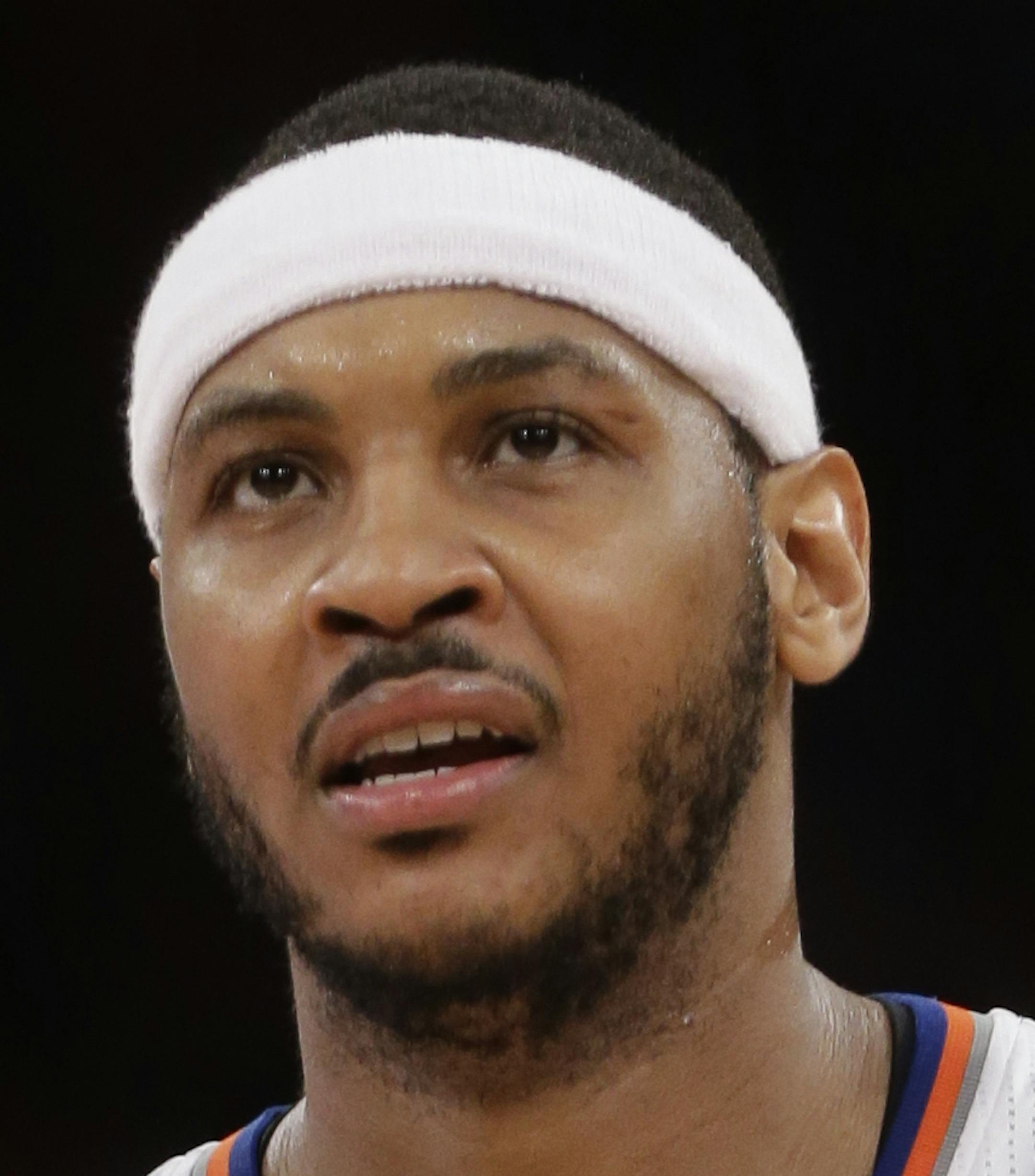 New York Knicks' Carmelo Anthony (7) reacts to a call during the second half of an NBA basketball game against the Brooklyn Nets Wednesday, April 2, 2014, in New York. The Knicks won the game 110-81. (AP Photo/Frank Franklin II) ORG XMIT: NYOTK