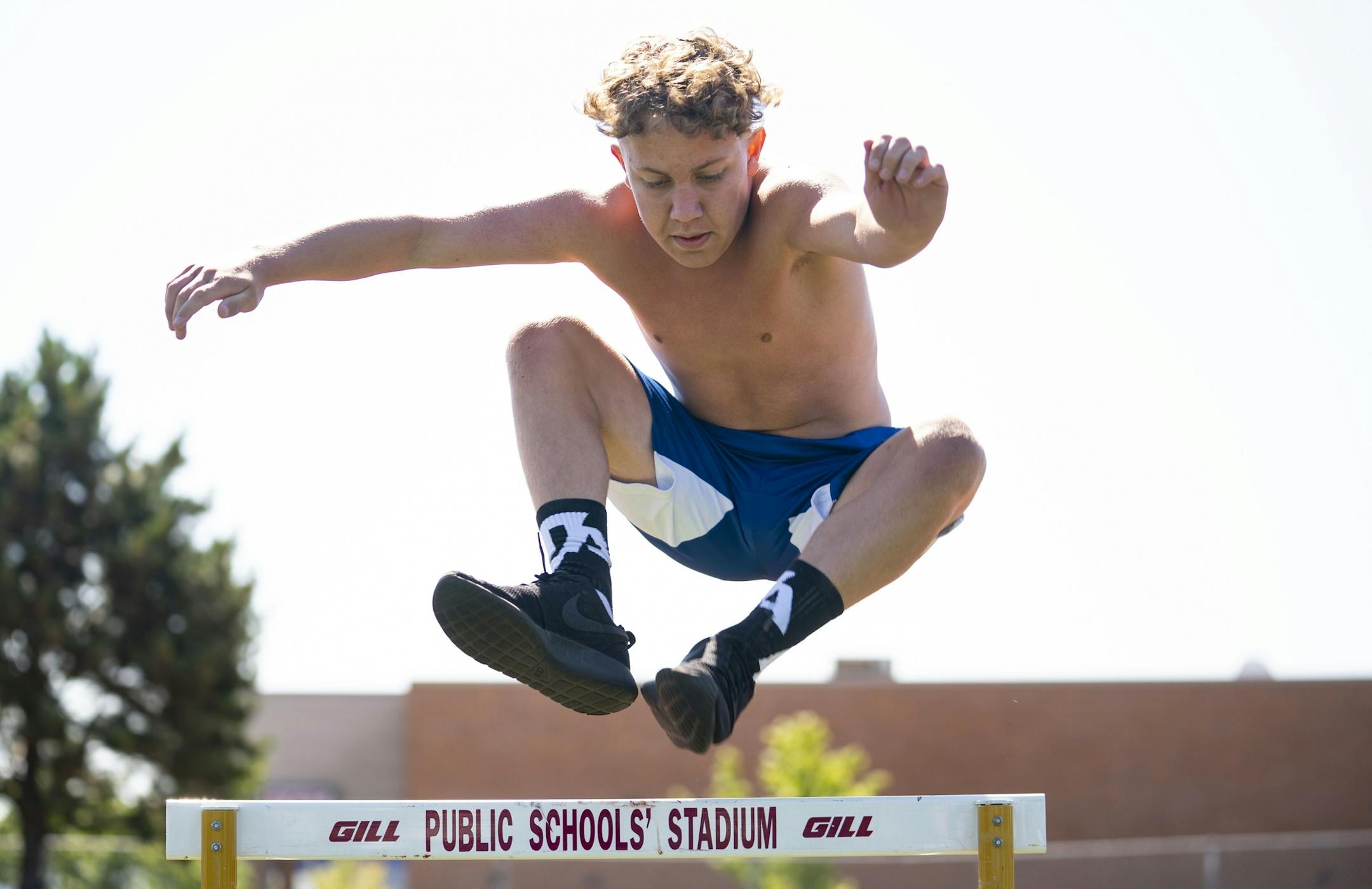 Gabe Johnson jumped over a hurdle as part of the Denfeld football team's workout on Tuesday morning.