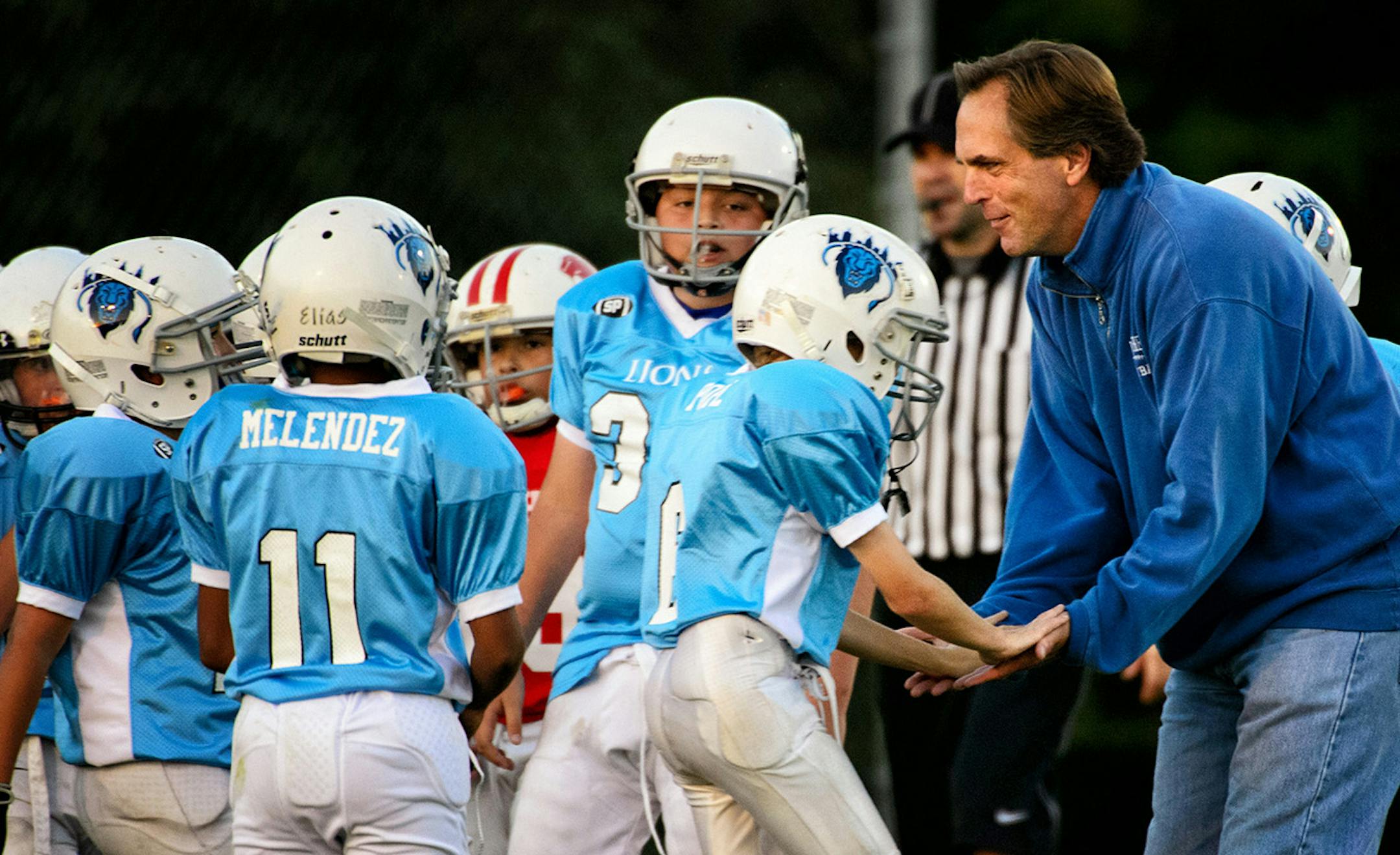 GOP candidate for Senate Mike McFadden congratulated his team after a good play. He coached his son's football team Tuesday, September 16, 2014 in West St. Paul. It is part of the Mendota Heights Youth Athletic Association. ] Tuesday, September 16, 2014 GLEN STUBBE * gstubbe@startribune.com