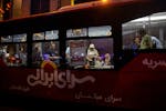People cast their ballots at a polling place set up inside a parked bus in Tehran, Iran on Friday, June 28, 2024. After a testy campaign that featured