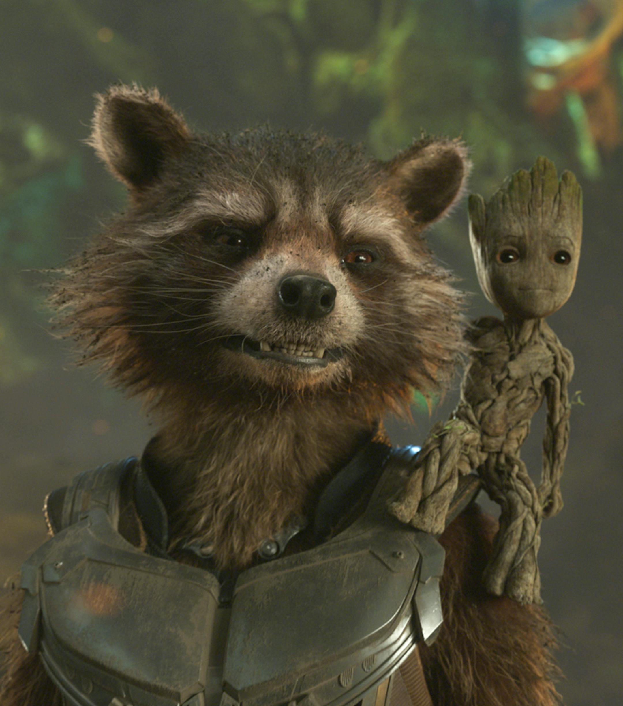 This image released by Disney shows the Rocket, voiced by Bradley Cooper, left, and Groot, voiced by Vin Diesel in a scene from Marvel's "Guardians Of The Galaxy Vol. 2." (Marvel Studios/Disney via AP)