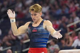 Shane Wiskus celebrates after competing on the pommel horse at the United States Olympic trials in men's gymnastics on Thursday night at Target Center
