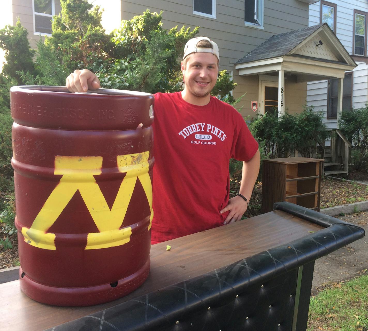 Kevyn Burger/Special to the Star Tribune Mike Mangusen, who graduated last spring ,recently moved out of a duplex and placed a vinyl-covered bar up for grabs on a curb, where he found three years ago. &#x201a;&#xc4;&#xfa;I hope someone takes it and has as good of a time with it as we did,&#x201a;&#xc4;&#xf9; he said.