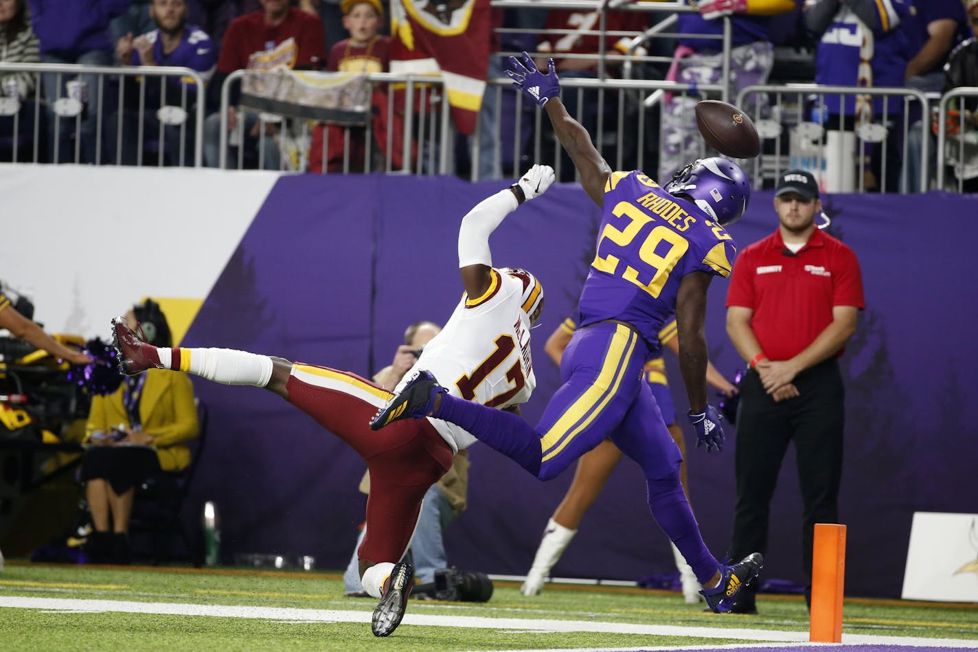 Minnesota Vikings cornerback Xavier Rhodes (29) breaks up a pass intended for Washington Redskins wide receiver Terry McLaurin (17) during the first half of an NFL football game, Thursday, Oct. 24, 2019, in Minneapolis. (AP Photo/Bruce Kluckhohn)