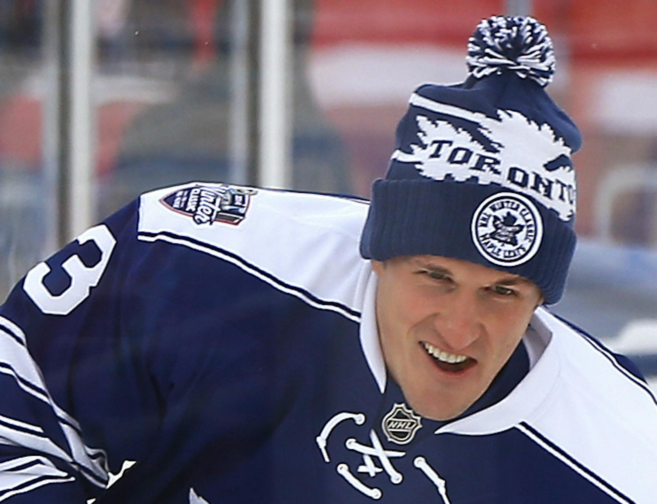 Toronto Maple Leafs defenseman Dion Phaneuf skates during practice on the outdoor rink for Wednesday's NHL Winter Classic hockey game against the Detroit Red Wings at Michigan Stadium in Ann Arbor, Mich., Tuesday, Dec. 31, 2013. The Maple Leafs signed captain Phaneuf to a $49 million, seven-year deal to keep the three-time All-Star defenseman under contract through the end of the 2020-21 season. (AP Photo/Paul Sancya)