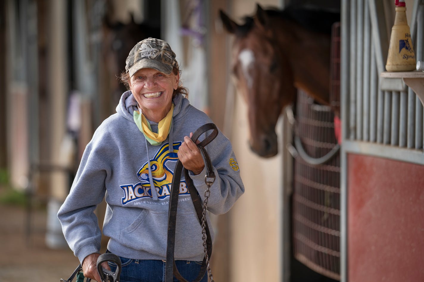 Virginia Peters, with her horse Where's Jordan in the background, is a rare one-person operation at Canterbury Park: breeder, owner and trainer. The retired teacher has a 20-acre farm near Jordan, Minn.