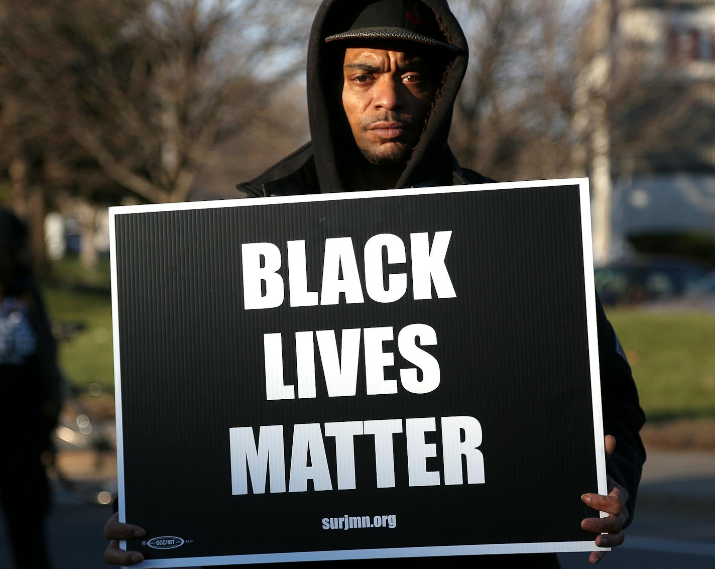 A man demonstrated at the Fourth Precinct station before heading downtown, where some protesters tried to enter the federal courthouse.