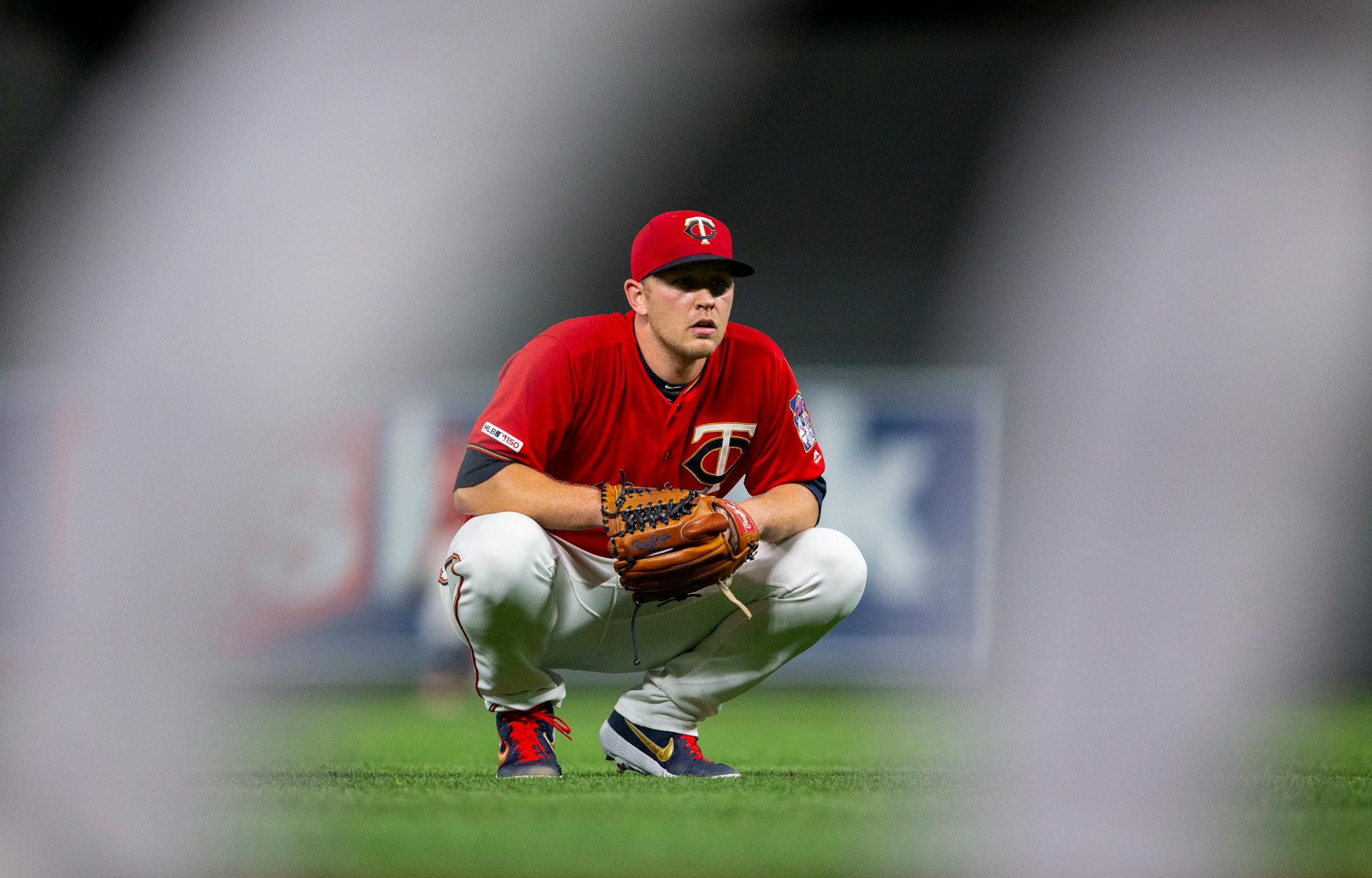 Twins relief pitcher Tyler Duffey crouched in disbelief