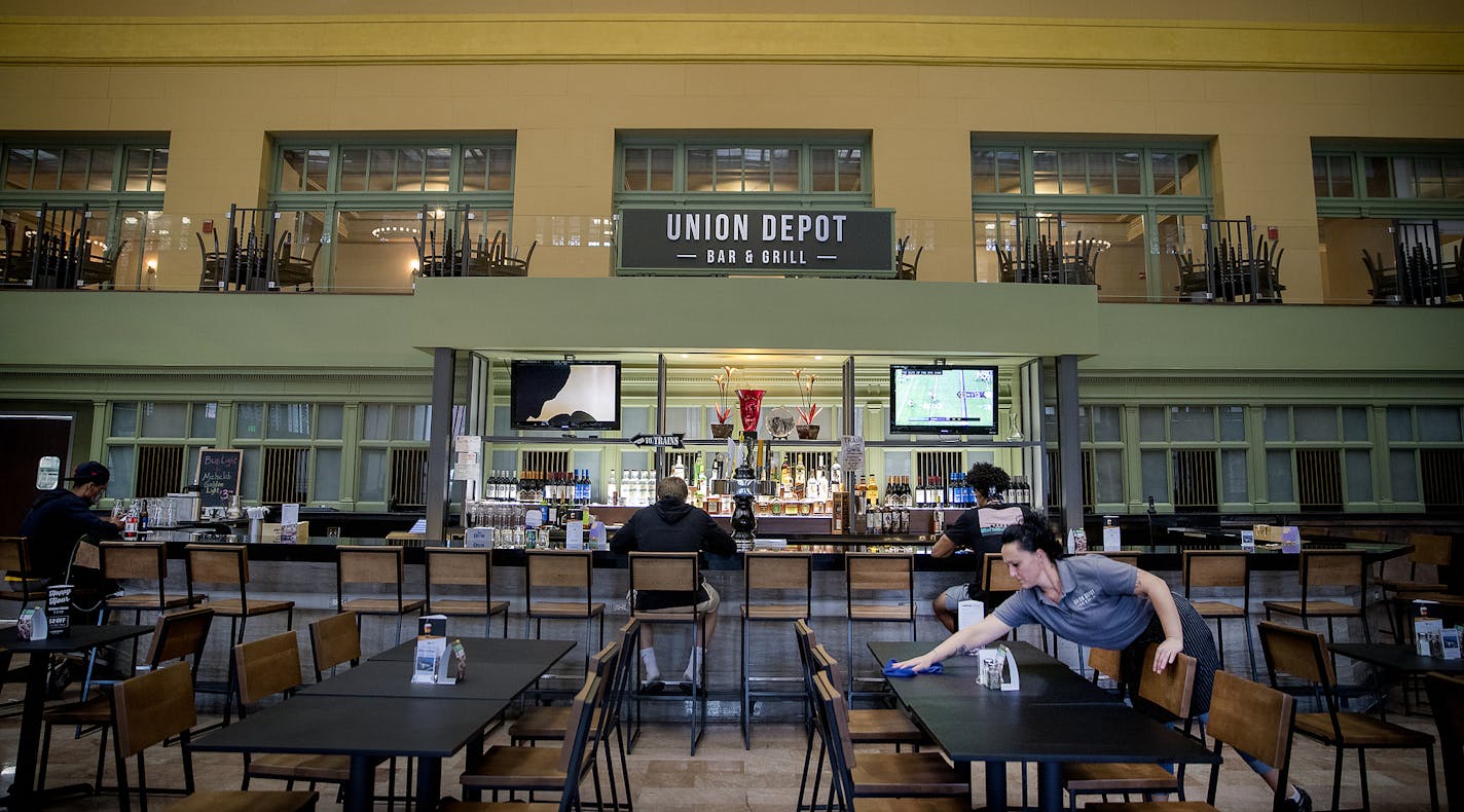 Union Depot Bar and Grill server Molly Ruhoff worked the tables at the new restaurant and bar just after the lunch rush on Aug. 24, 2018 in St. Paul. A Minneapolis nonprofit is poised to take over the restaurant at the request of the operator, which has reported slow sales.