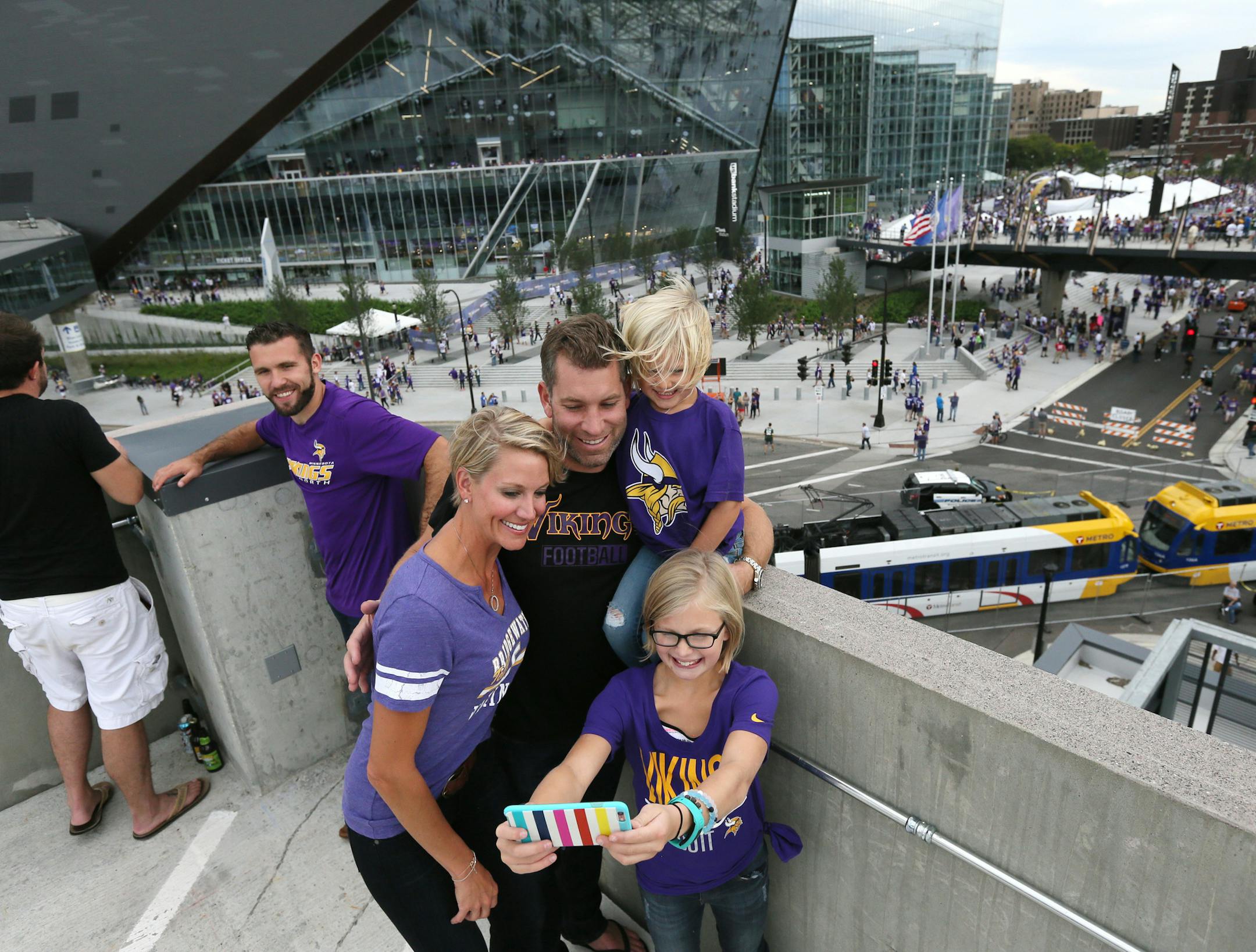 The Minnesota Vikings open the new US Bank Stadium for their first home regular season game against the Green Bay Packers. Here, The Horning family, Sara, Tedd, Isabella, 9 and Brooklyn, 4 of Watertown South Dakota take a selfie outside the new US Bank Stadium. ] Minnesota Vikings vs Green Bay Packers - Vikings home opener in new US Bank Stadium. brian.peterson@startribune.com
Minneapolis, MN - 09/18/2016