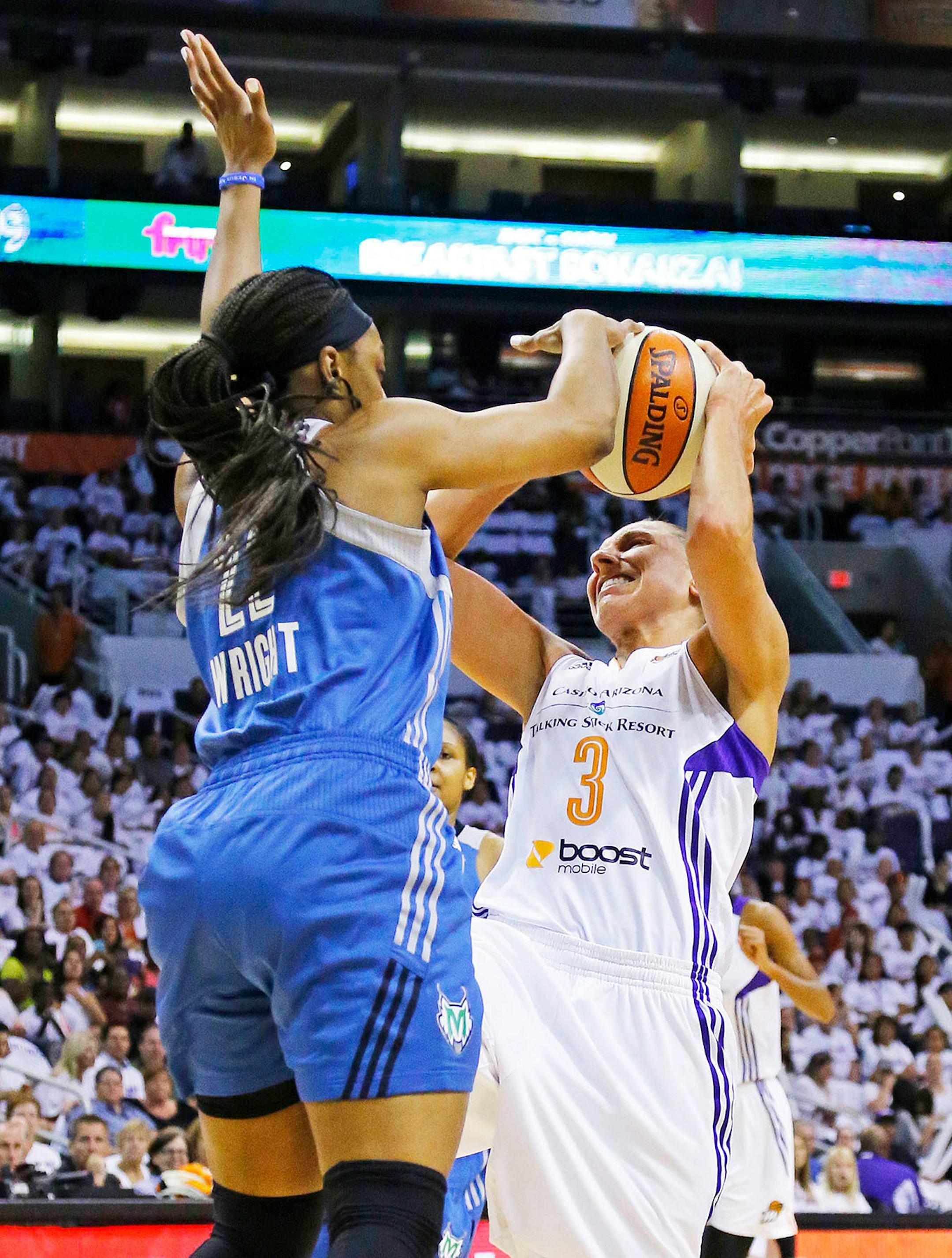 Phoenix Mercury guard Diana Taurasi (3) is fouled by Minnesota Lynx guard Monica Wright (22) during the first quarter of Game 1 of the WNBA Western Conference finals Friday, Aug. 29, 2014 in Phoenix, Ariz.