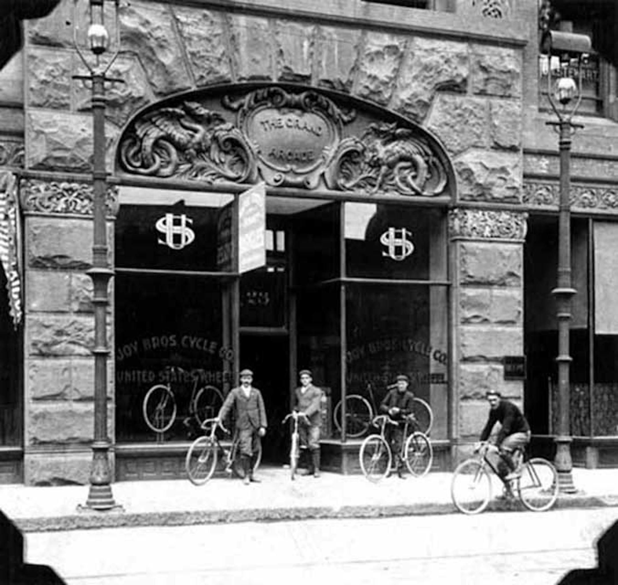 In 1896 Joy Brothers Cycle Co. occupied a storefront in the Grand Arcade beneath an elaborate carved sign.