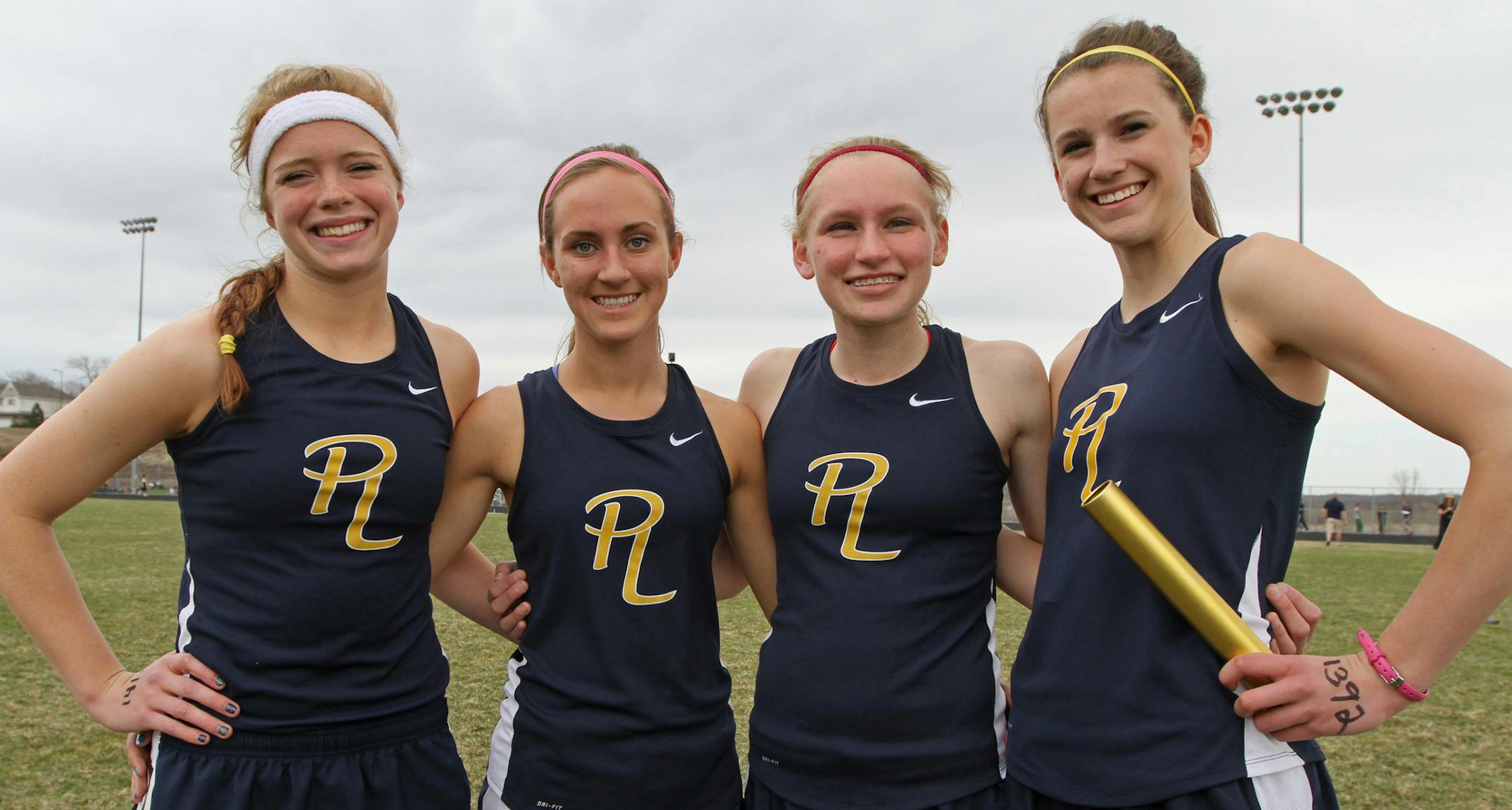 (left to right) Prior Lake High School Track Team 4 X 800 relay event members, Macy Violett, Mackenzie Schell, Megan Hovick and Madi Scholl, photographed during competition at the school on 4/30/13. Bruce Bruce Bisping/Star Tribune Macy Violett, Mackenzie Schell, Megan Hovick, Madi Scholl/source.