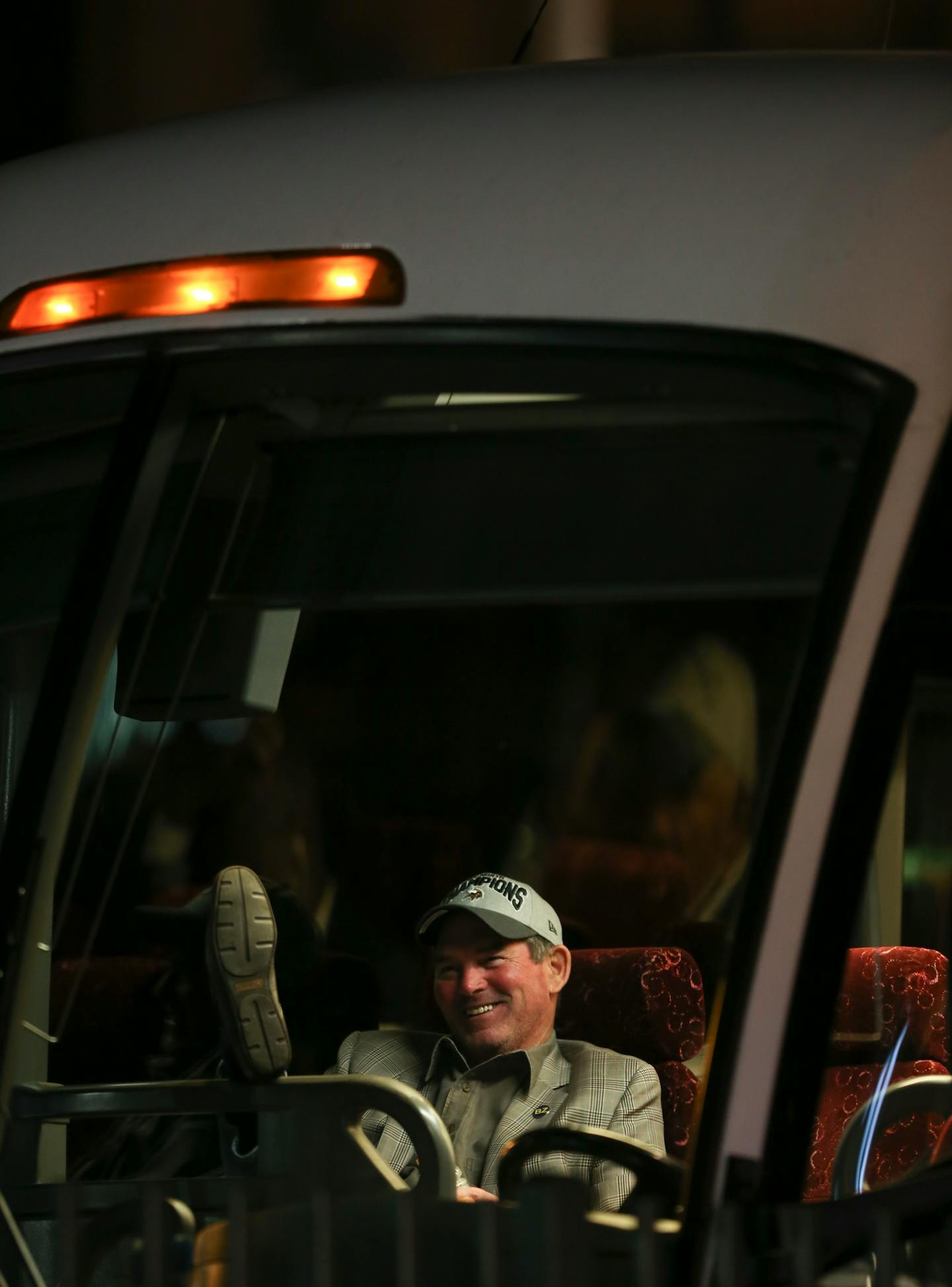 Wearing a division championship cap, Vikings head coach Mike Zimmer relaxed in the front of the bus as the Vikings waited to leave Lambeau Field after defeating the Packers Sunday night. ] JEFF WHEELER � jeff.wheeler@startribune.com The Minnesota Vikings beat the Green Bay Packers 20-13 in the final regular season game of season Sunday, January 3, 2016 at Lambeau Field in Green Bay, WI.