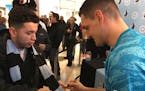 New Minnesota United goalkeeper Vito Mannone signed a supporters' scarf for a fan after the team showed off its new kits, or jerseys, for the 2019 sea