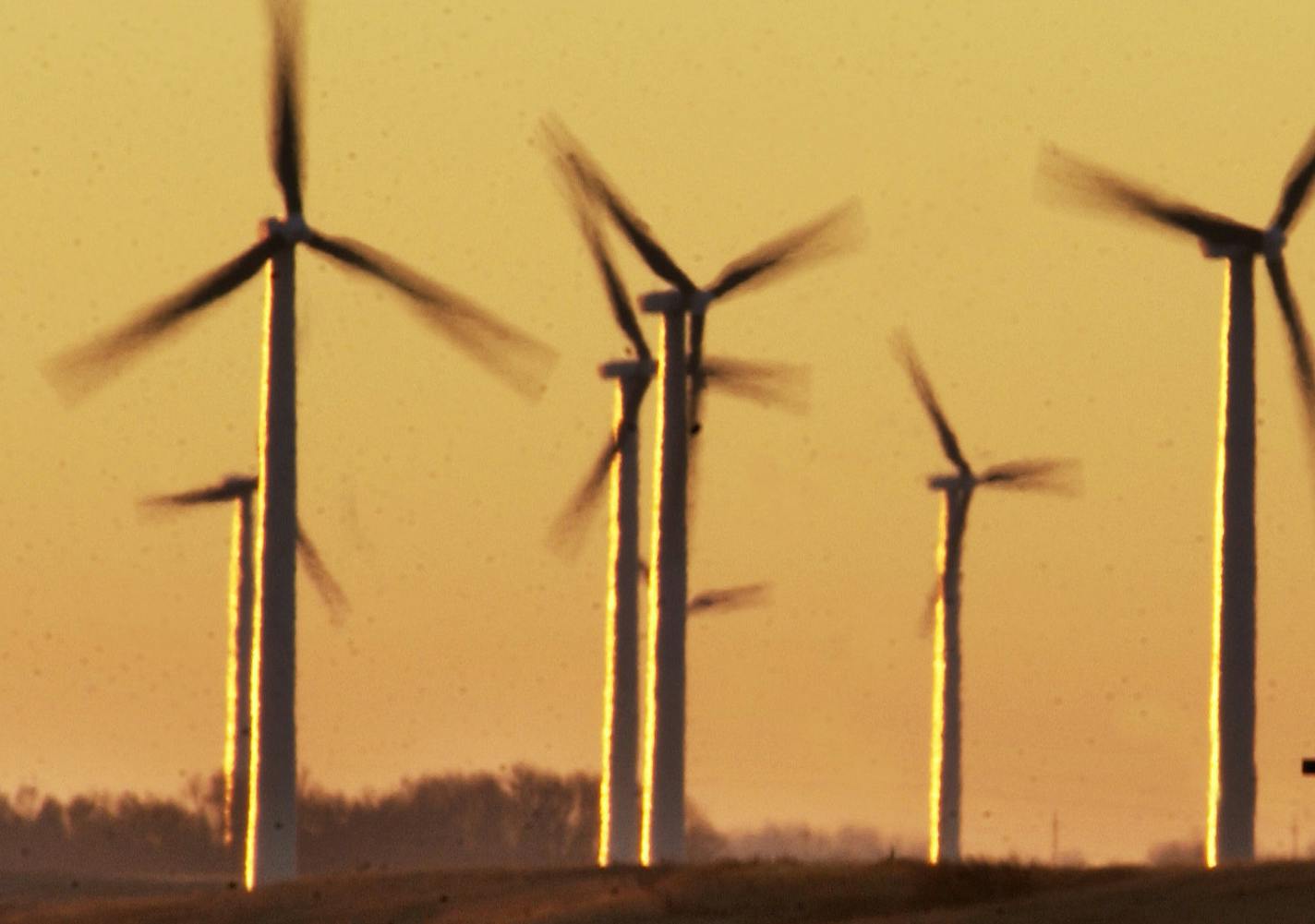 WEDNESDAY_11/12/03_Hendricks - - - - - - Wind generators turning atop the Buffalo Ridge between Hendrick and Lake Benton at sunrise.