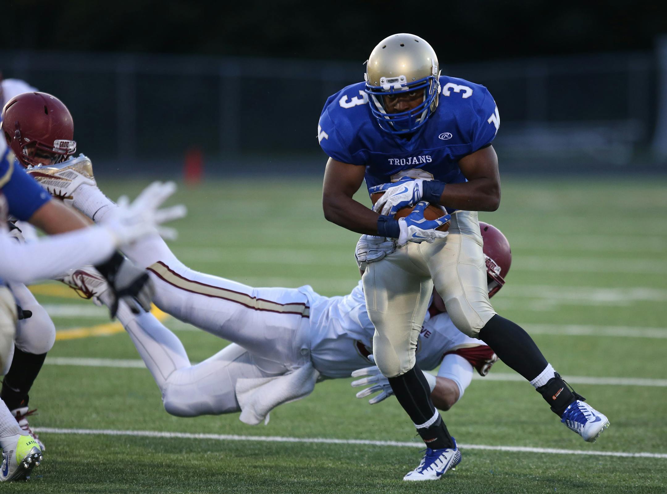Wayzata's Anthony Clark broke a Maple Grove tackle for more yardage during the first half.