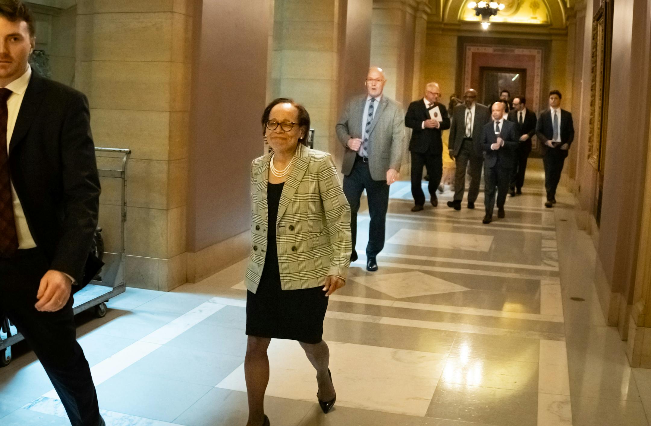 Natalie Hudson walked toward the State Capitol Rotunda for the announcement.