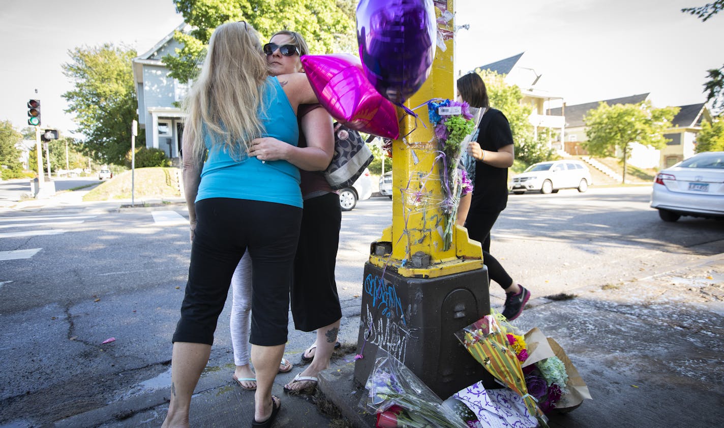 Those who identified only as extended members of the family of Sheryl and Kenneth Carpentier, two of the victims, hugged after putting up balloons and flowers on the growing memorial outside of Matt's Bar. ] LEILA NAVIDI &#xef; leila.navidi@startribune.com BACKGROUND INFORMATION: A memorial for the victims is seen outside of Matt's Bar in Minneapolis on Sunday, September 23, 2018. A teenager speeding from state troopers in a stolen SUV hit another vehicle and killed three people early Sunday at