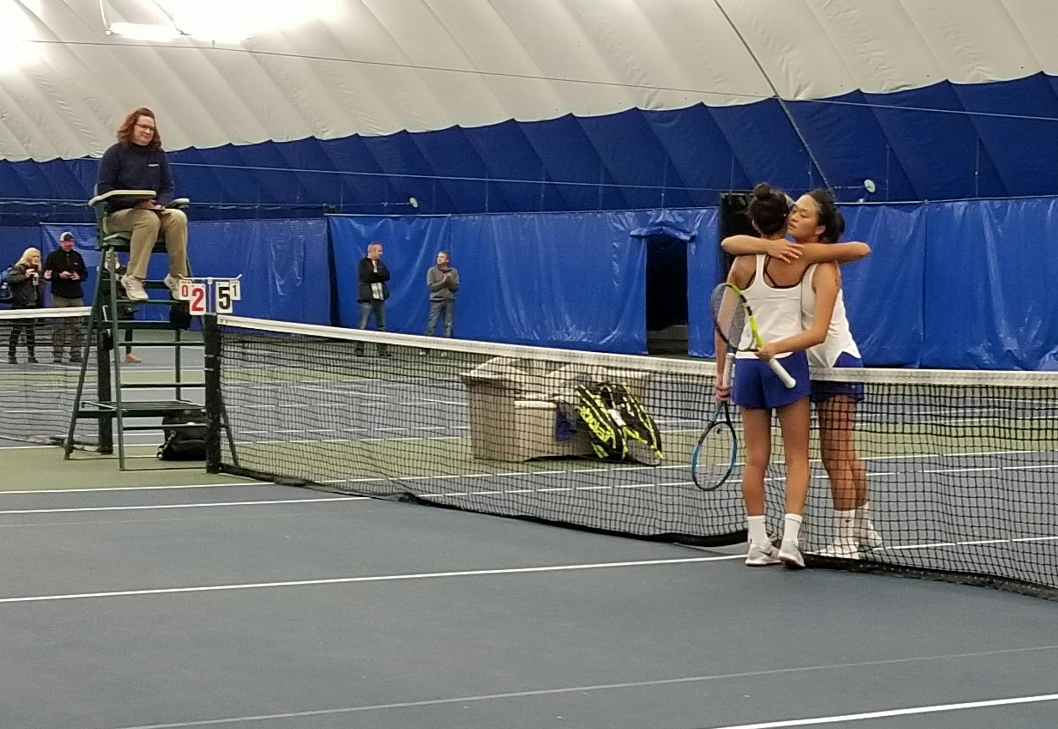 Senior Arlina Shen (right) and Blake teammate Sonia Baig hug at the net after their Class 1A singles match Friday at Reed-Sweatt Family Tennis Center. Photo: Heather Rule, Special to the StarTribune