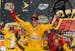 Joey Logano celebrates in the victory lane after winning the NASCAR Sprint Cup Series auto race at Phoenix International Raceway, Sunday, Nov. 13, 201