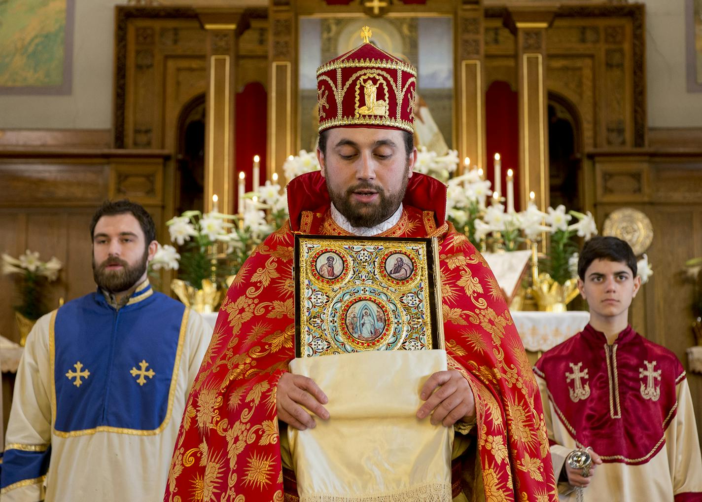 Altar servers stand behind Father Tadeos Barseghyan during the end of a Sunday service.] BRIDGET BENNETT SPECIAL TO THE STAR TRIBUNE &#x2022; bridget.bennett@startibune.com Sunday, April 12, 2015 during a church service at St. Sahag Armenian Church in St. Paul, MN. St. Sahag Armenian Church is a hub of the Armenian community. One hundred years ago this month, the first of 1.5 million Armenians were killed by the Ottoman Turk.