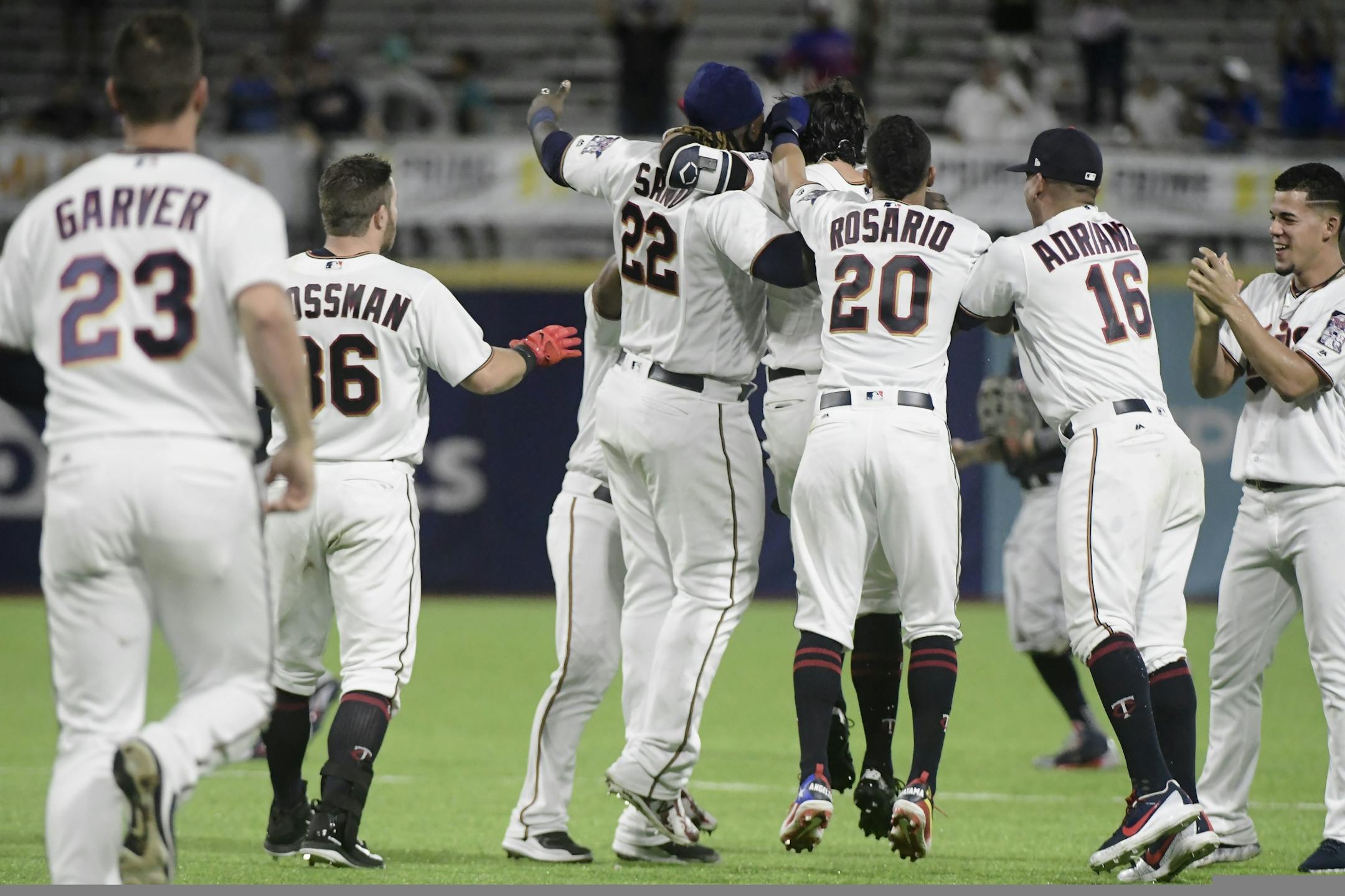 The Minnesota Twins celebrate a 2-1 win over the Cleveland Indians in 16 innings in a baseball game at Hiram Bithorn Stadium in San Juan, Puerto Rico, early Thursday, April 19, 2018.