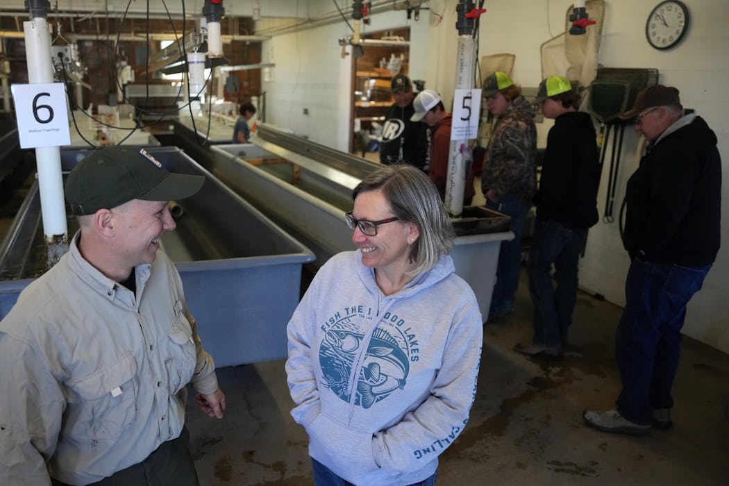 Waterville hatchery supervisor Craig Soupir, left, talks with Sarah Strommen, Department of Natural Resources commissioner, on Wednesday during the open house. Soupir said a new hatchery is vital piece in continuing to stock Minnesota waters.