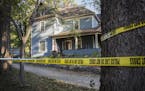 A home in Jordan is taped off during a manhunt for a suspect of a double shooting in Chaska on Friday, October 2, 2015.