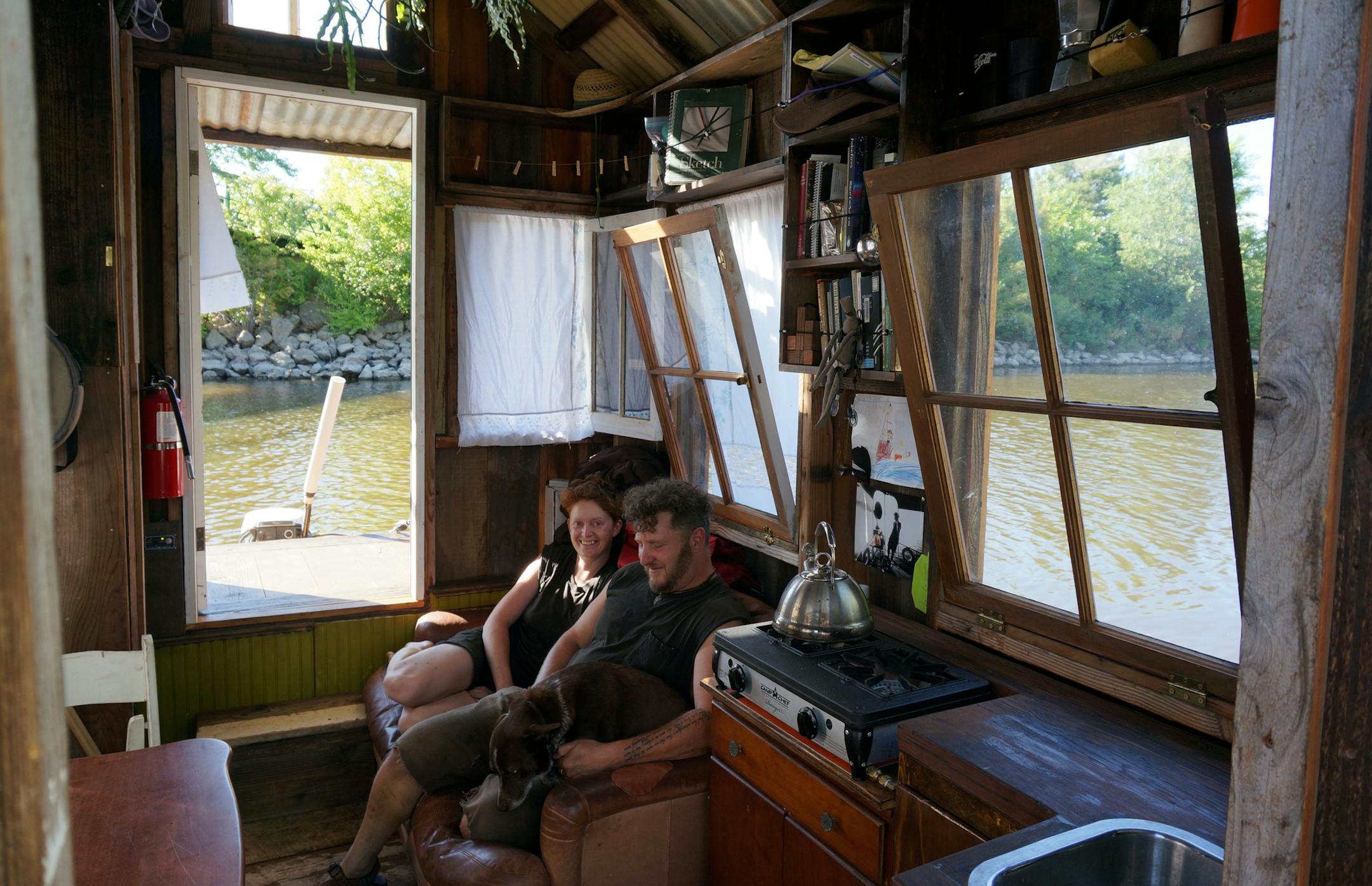 Wes Modes, Kai Dalgleish and their dog Hazel are making a month-long trip down the Mississippi River in a shanty boat. They launched from Boom Island Park in Minneapolis on July 26, 2014, and hope to reach Quad Cities, along the Illinois-Iowa border, in a month. Photo by Dylan Peers McCoy, Special to the Star Tribune