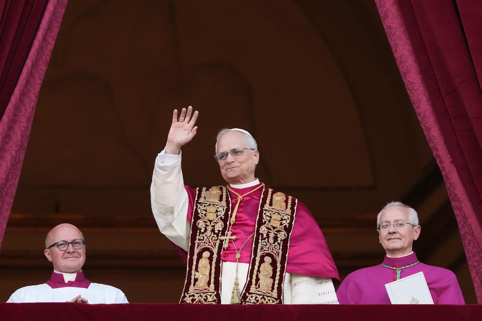 Cardinal Robert Prevost appears on the central loggia of St. Peter's Basilica after being chosen the 267th pontiff of the Roman Catholic Church, choosing the name of Pope Leo XIV, at the Vatican, Thursday, May 8, 2025.