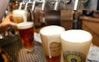 In a June 6, 2008, file photo, a row of freshly poured draft beers are seen in Pittsburgh.