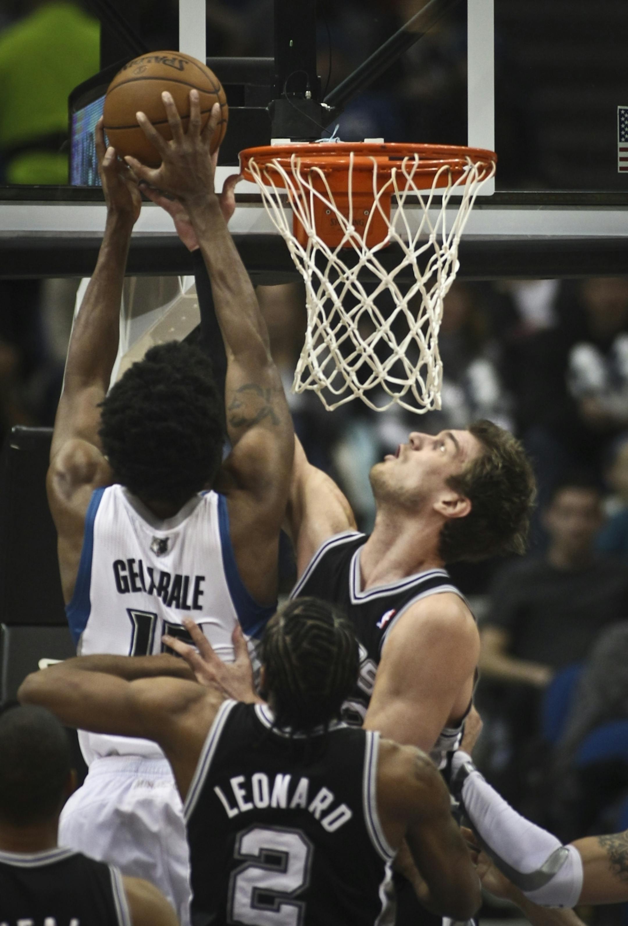 Minnesota Timberwolves small forward Mickael Gelabale (15) went up for a shot against San Antonio Spurs center Tiago Splitter (22) during the first quarter of a Timberwolves verses Spurs NBA basketball game at the Target Center on Wednesday, February 6, 2013.
