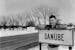 Bob Bruggers stands by a sign in front of his hometown of Danube, Minn., in 1962. Bruggers went on to play for the Gophers and then the NFL.