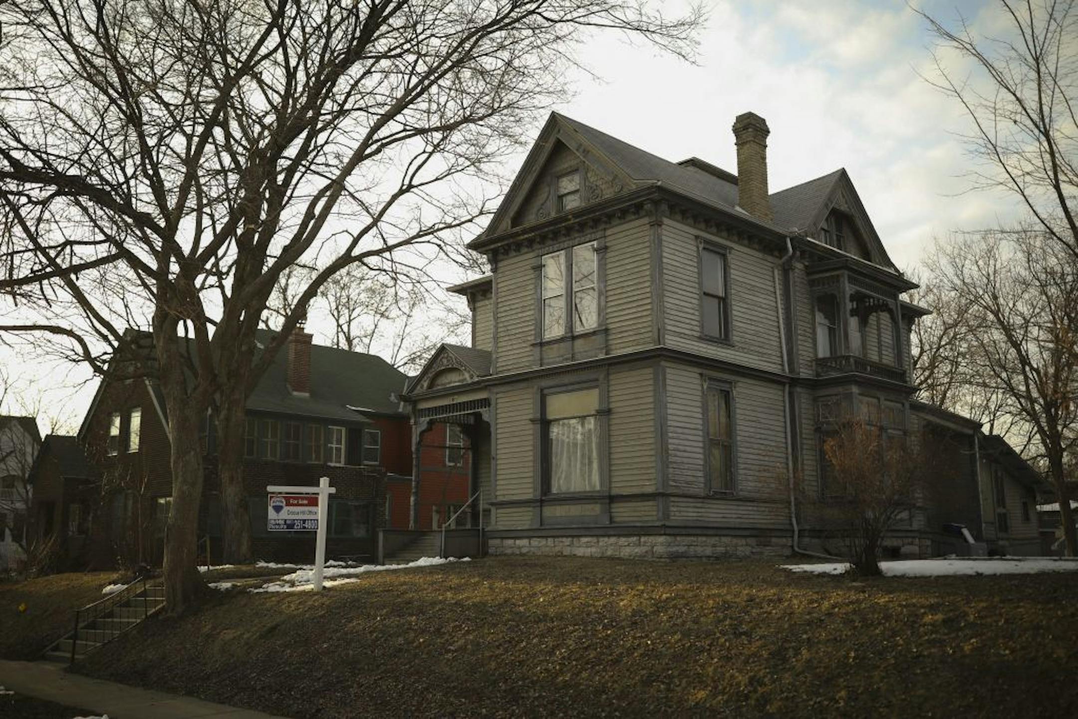 The house at 1905 Iglehart Ave., right, where Michael Tierney and his eight siblings grew up. At left is 1911 Iglehart Ave., which his family also owns and hopes to sell.