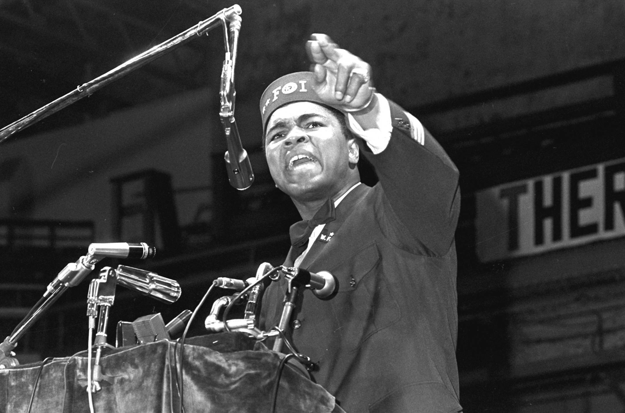 FILE - In this Feb. 25, 1968 file photo, former heavyweight boxing champion Muhammad Ali addresses a gathering at a Black Muslim convention in Chicago. A new documentary about Ali, "Trials of Muhammad Ali," gives a glimpse of how many Americans felt about him during a tumultuous time in the country's history. (AP Photo/File) ORG XMIT: MIN2013101513453054