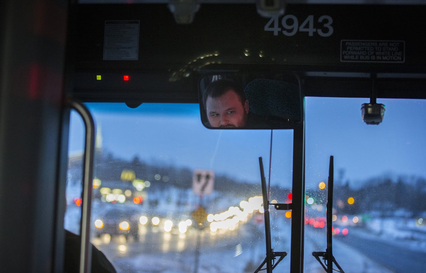 Bus driver Matt Baker drives the new Suburb to Suburb Transit Service bus with no passengers on the route from Maple Grove to Plymouth during the morning rush hour on Monday, February 8, 2016. ] (Leila Navidi/Star Tribune) leila.navidi@startribune.com