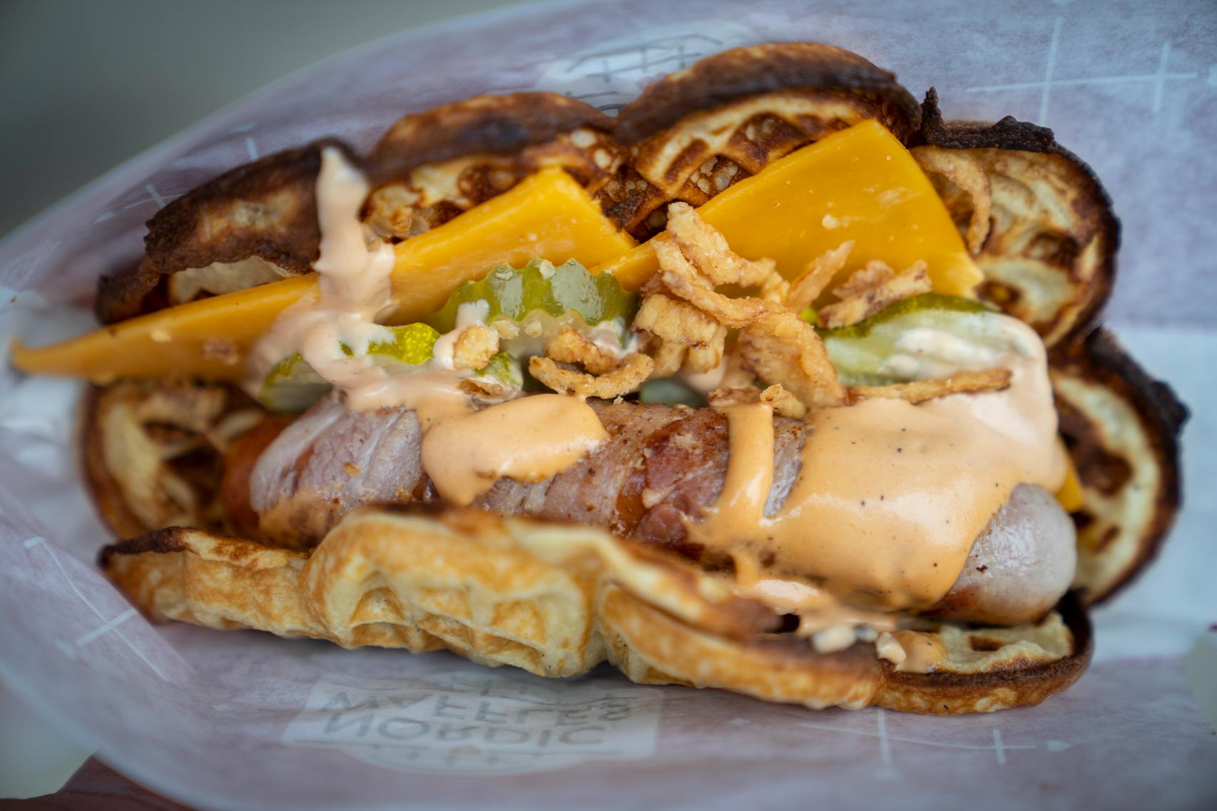 The Bacon-Wrapped Waffle Dog from Nordic Waffles. The new foods of the 2023 Minnesota State Fair photographed on the first day of the fair in Falcon Heights, Minn. on Tuesday, Aug. 8, 2023. ] LEILA NAVIDI • leila.navidi@startribune.com