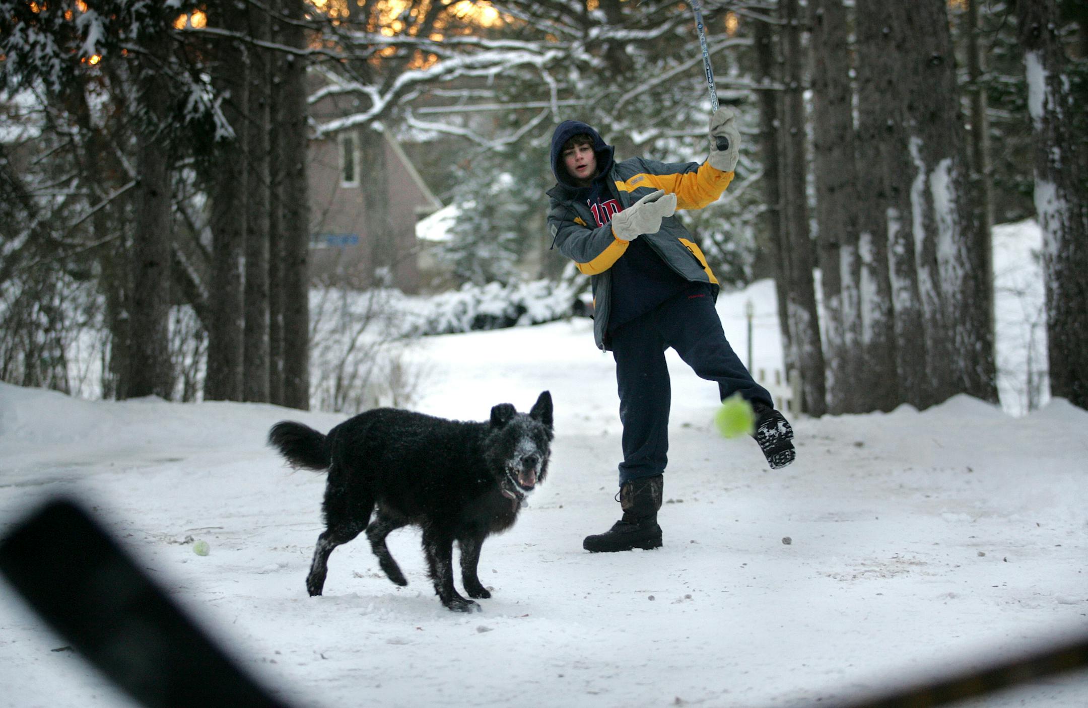 Ari Waisbren, 14, played hockey in the driveway after school with his dog, Charlie, and his father. Steven Waisbren and his wife, Bernadette, are helping to get Lionsgate Academy started.