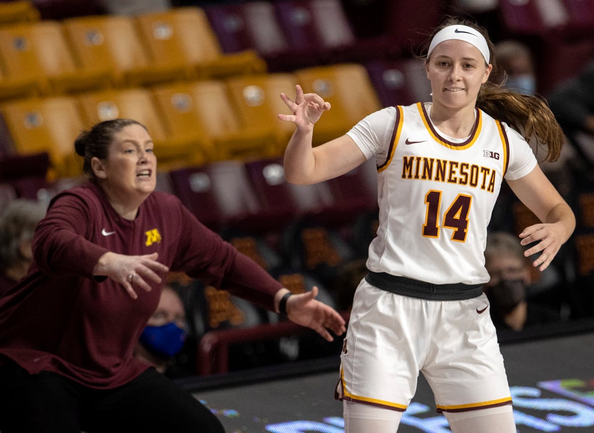 Gophers guard Sara Scalia celebrated making one of her nine three-pointers in a 99-93 victory over Ohio at Williams Arena, while coach Lindsay Whalen 