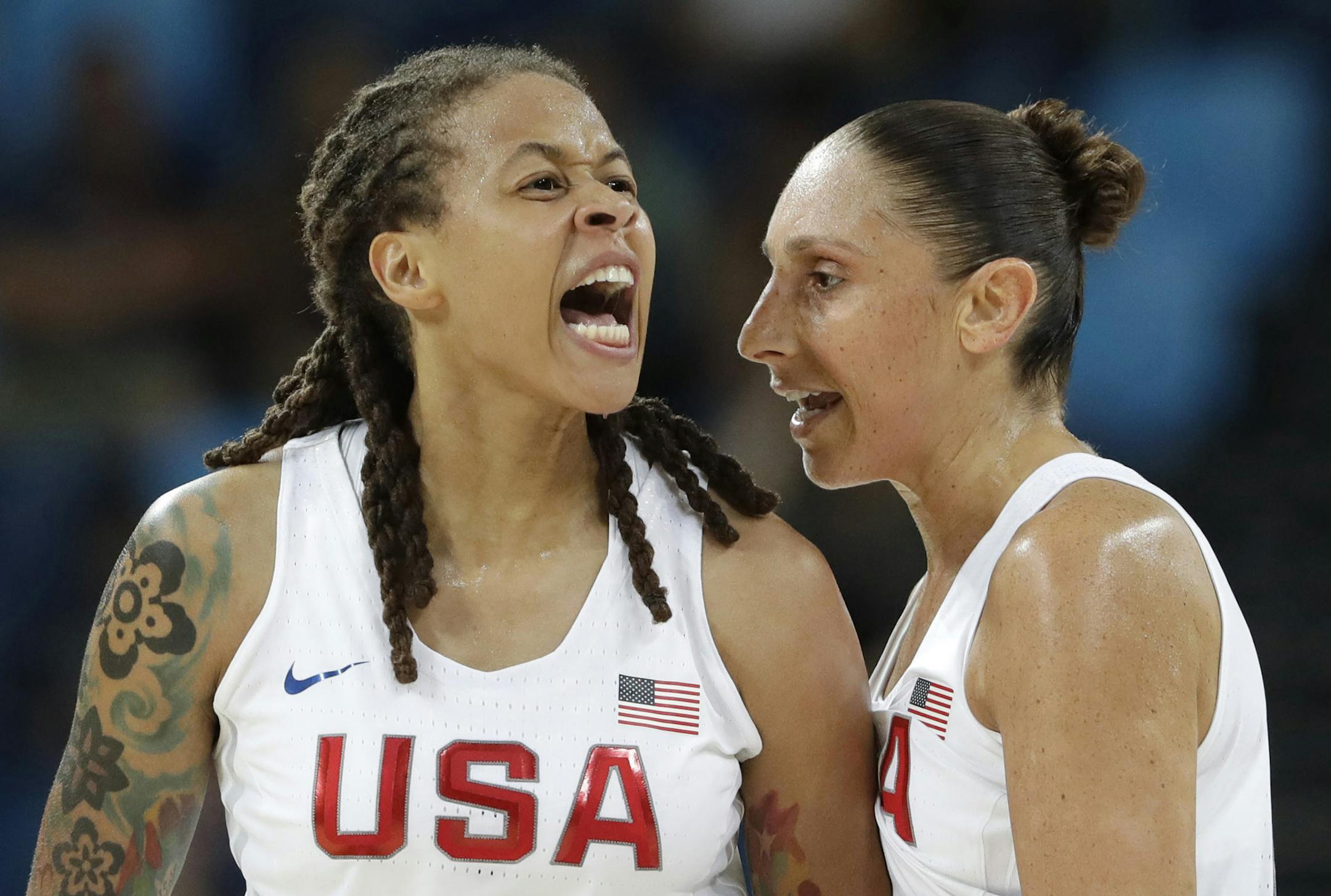 United States' Seimone Augustus (5), with teammate Diana Taurasi, reacts to a score against Japan during a women's quarterfinal round basketball game at the 2016 Summer Olympics in Rio de Janeiro, Brazil, Tuesday, Aug. 16, 2016. (AP Photo/Eric Gay)