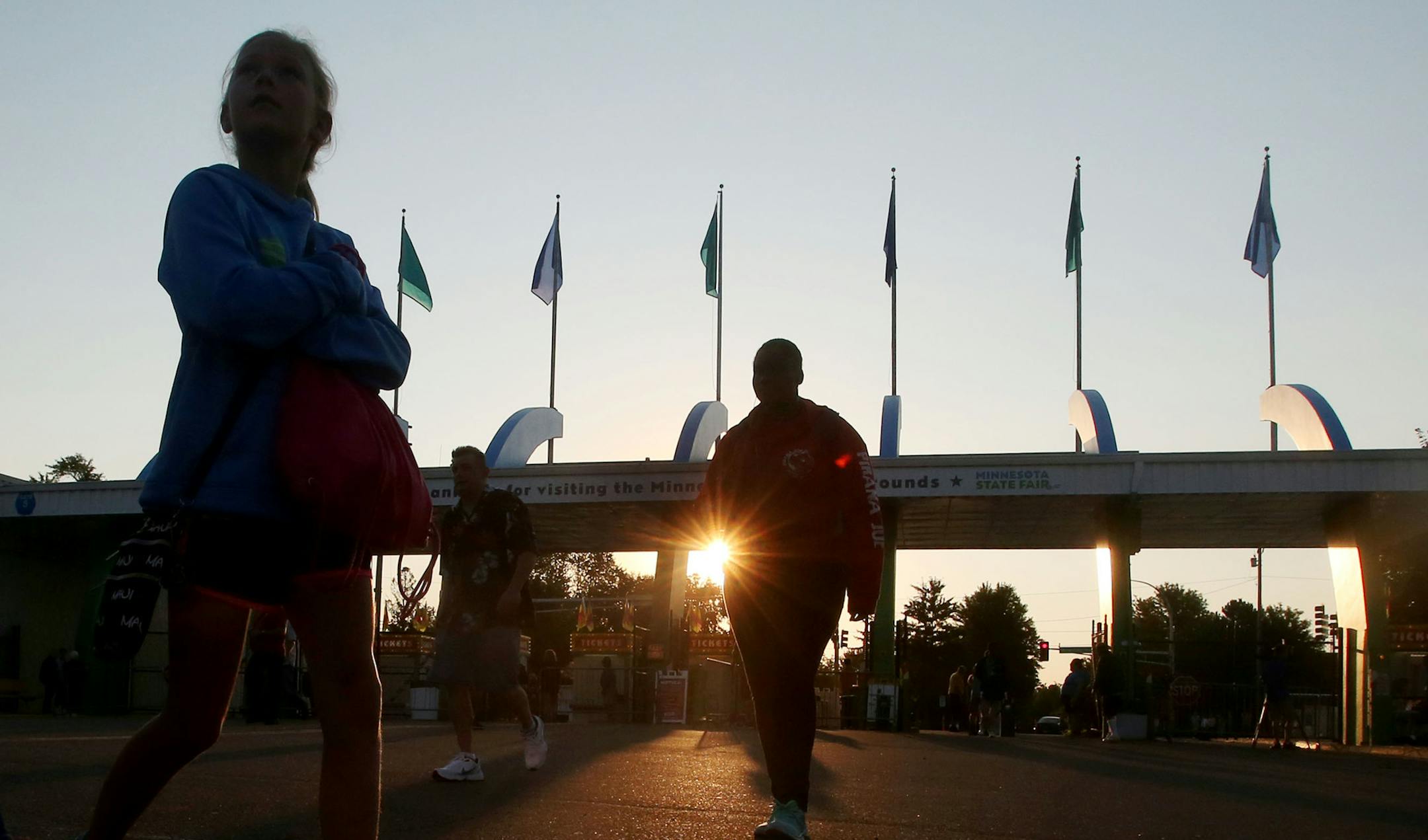 The sun rose above gate number 5 on the first day of the Minnesota State Fair Thursday, Aug. 25, 2016, in Falcon Heights, MN. ](DAVID JOLES/STARTRIBUNE)djoles@startribune Opening day at the Minnesota State Fair