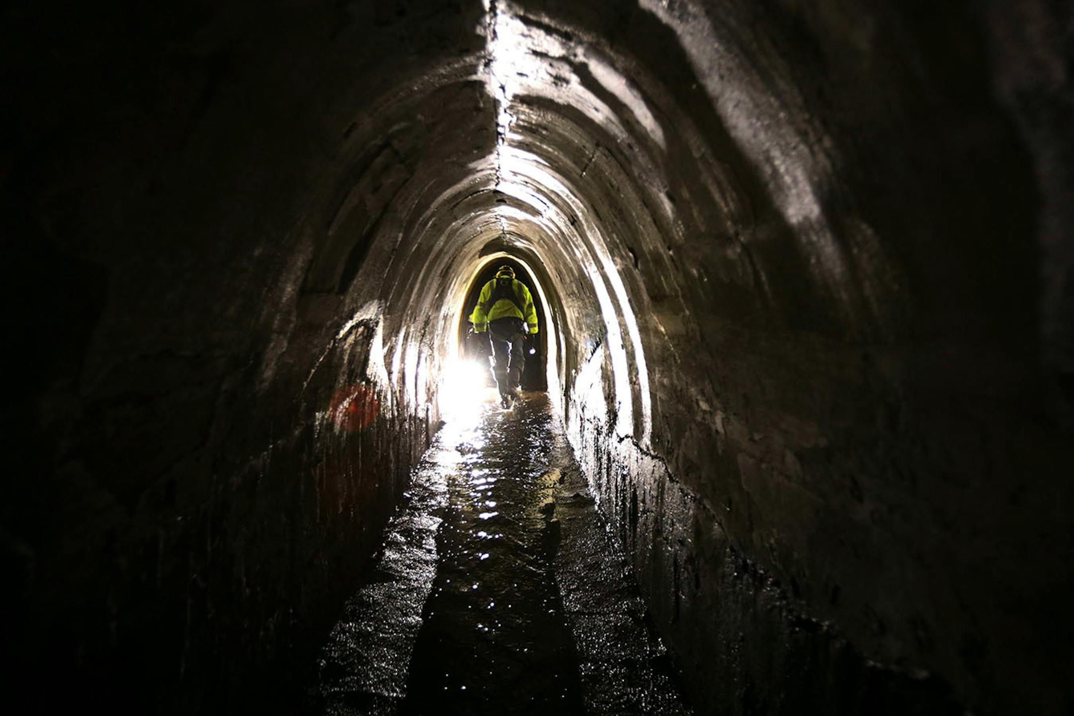 Officials with Minneapolis' Public Works Department, led a tour of the city's storm sewers underground in the northeast.