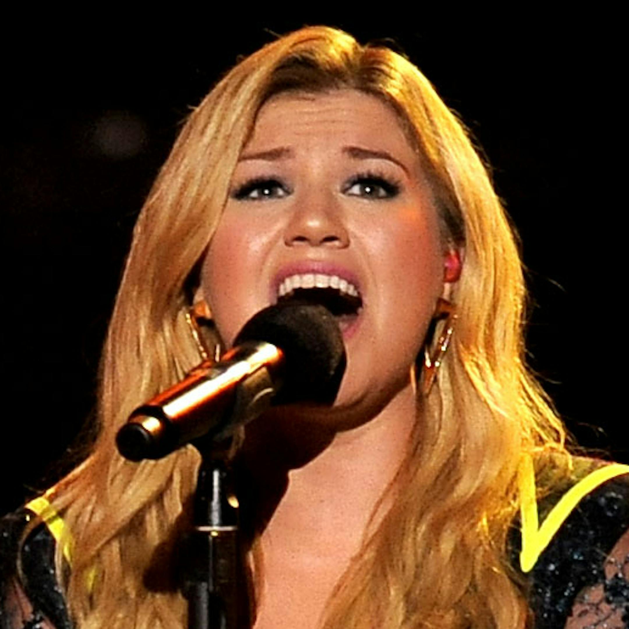 FILE - In this Dec. 16, 2012 file photo, Kelly Clarkson performs at VH1 Divas at the Shrine Auditorium in Los Angeles. Kelly Clarksonís No. 1 hit, ìStronger (What Doesnít Kill You),î is nominated for record of the year at Grammy Awards on Feb. 10, 2013. The song is also up for song of the year and best pop solo performance, and her fifth album, ìStronger,î is nominated for best pop vocal album. (Photo by Chris Pizzello/Invision/AP, File) ORG XMIT: MIN201302061620096