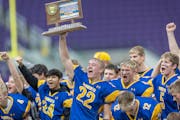 Minneota's team celebrates their 38-21 win over  Springfield in the Class A division of the Minnesota Prep Bowl at U.S. Bank Stadium, in Minneapolis, 