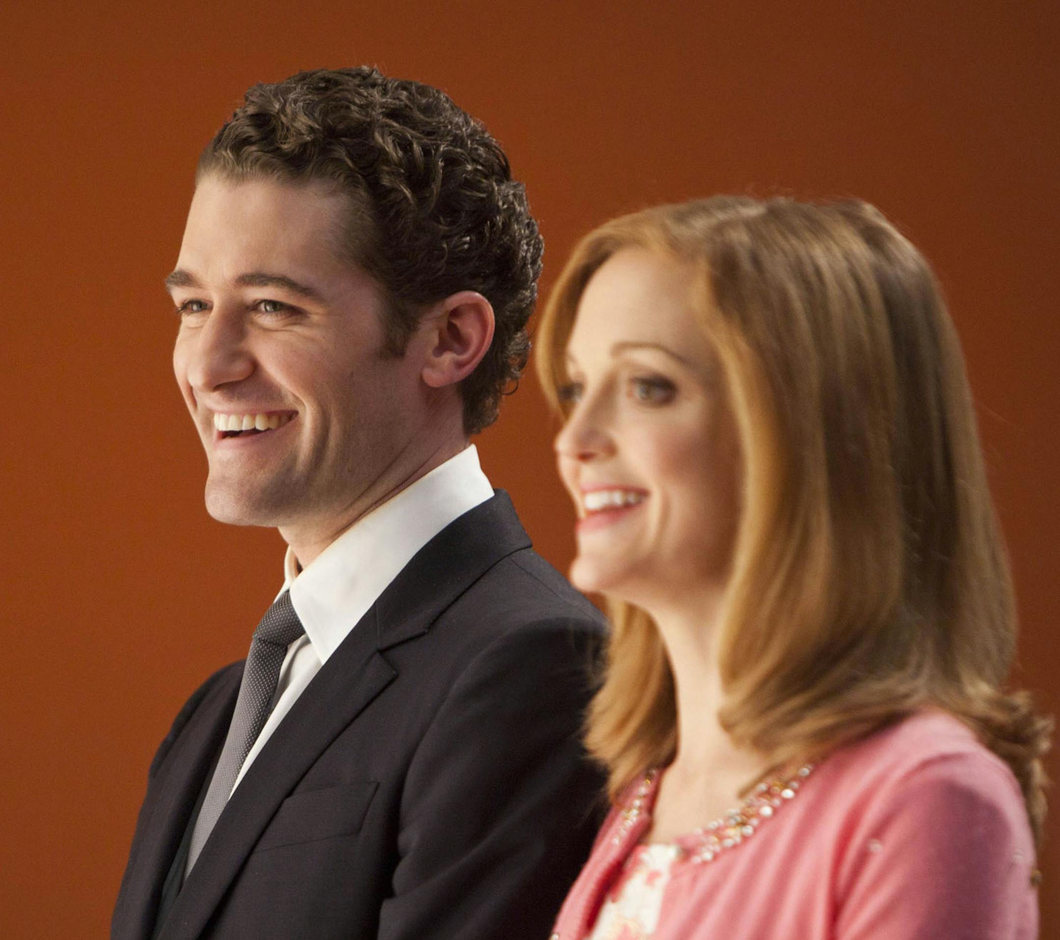 GLEE: Will (Matthew Morrison, L) and Emma (Jayma Mays, R) watch sectionals in the "Hold on to Sixteen" episode of GLEE airing Tuesday, Dec. 6 (8:00-9:00 PM ET/PT) on FOX. ©2011 Fox Broadcasting Co. Cr: Adam Rose/FOX