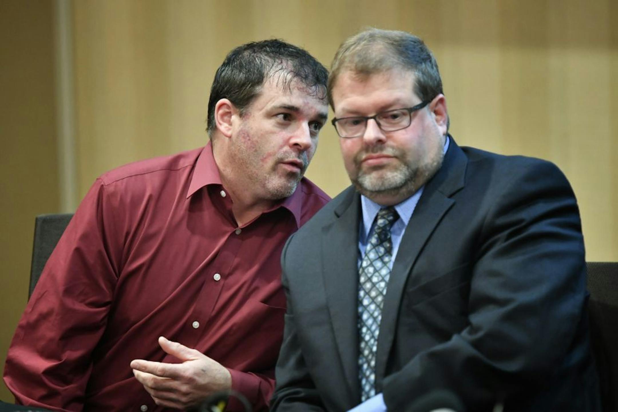 Ryan Larson talked with his attorney Devon Jacob at a press conference along with Dan Rassier and his attorney Michael Padden held a press conference at the Marriott Northwest Hotel in Brooklyn Park.