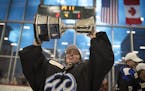 Minnesota Whitecaps goalie Amanda Leveille celebrates with the Isobel Cup at TRIA Rink on Sunday, March 17, 2019 in St. Paul, Minn. The Whitecaps beat