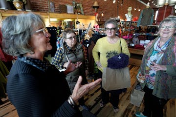 Wild Ginger Boutique owner Roxanne Bartsh, left, talked with loyal customers Mandy Boardman, Mary Laven and Beth Kraft in the downtown Zumbrota shop. 